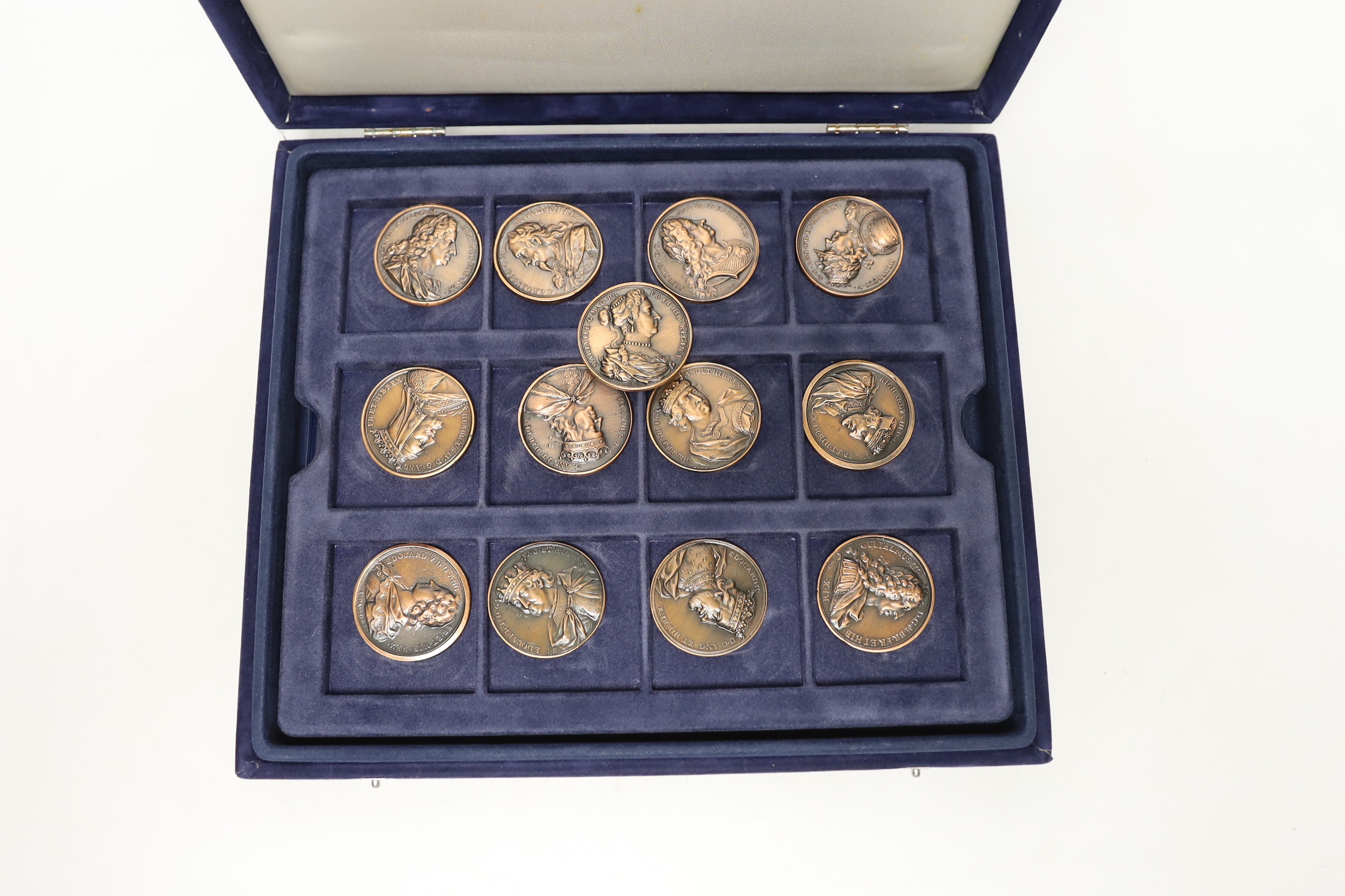 A cased set of Westminster Jean Dassier Collection AE Commemorative Monarchs of Britain medals.